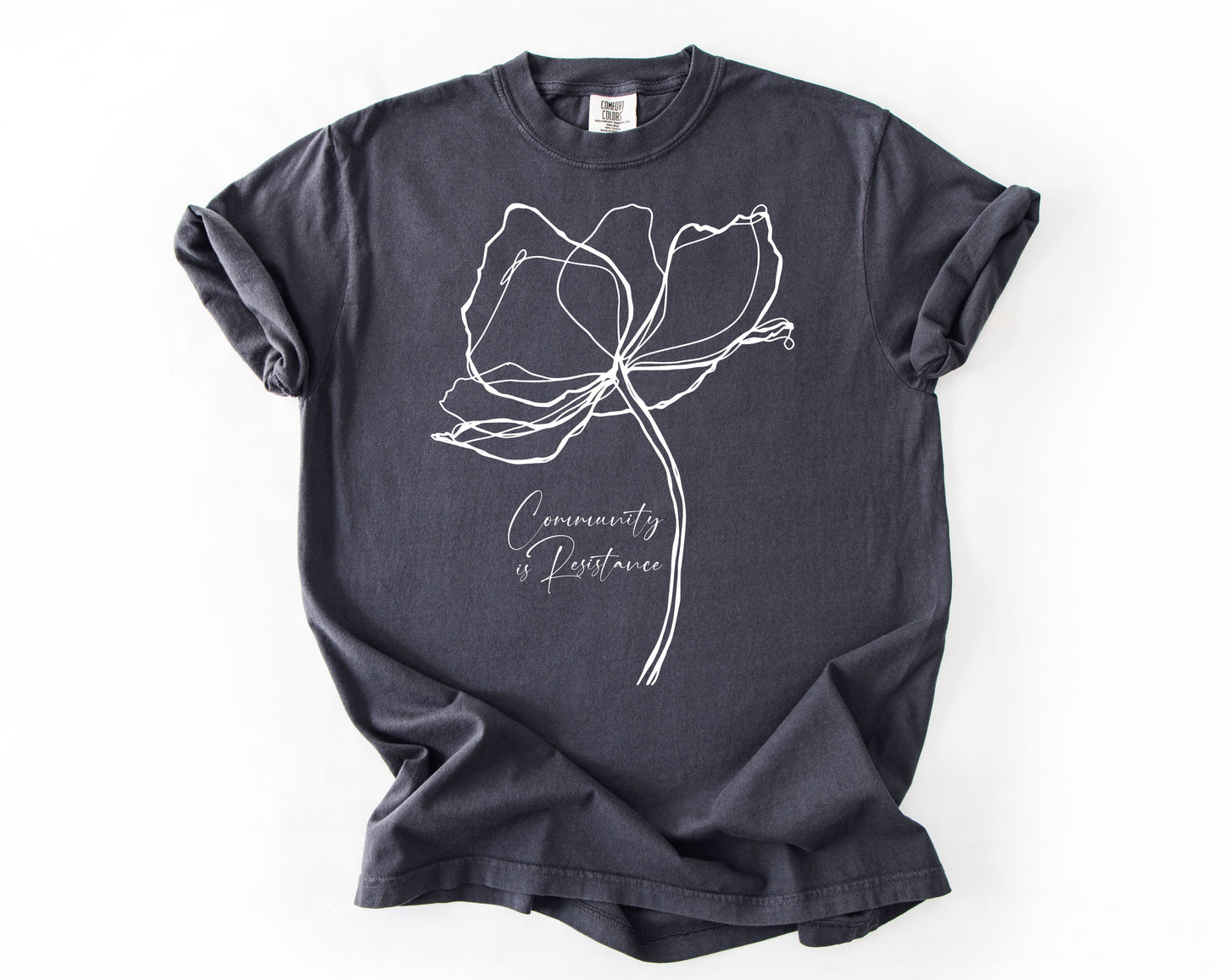 Graphite t-shirt with Community Is Resistance botanical graphic – resistance shirt