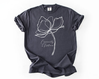 Graphite t-shirt with Community Is Resistance botanical graphic – resistance shirt