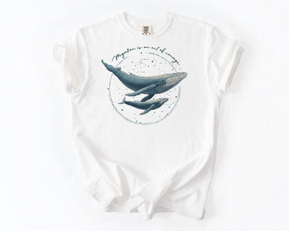 White t-shirt with migration whale graphic – human rights shirt