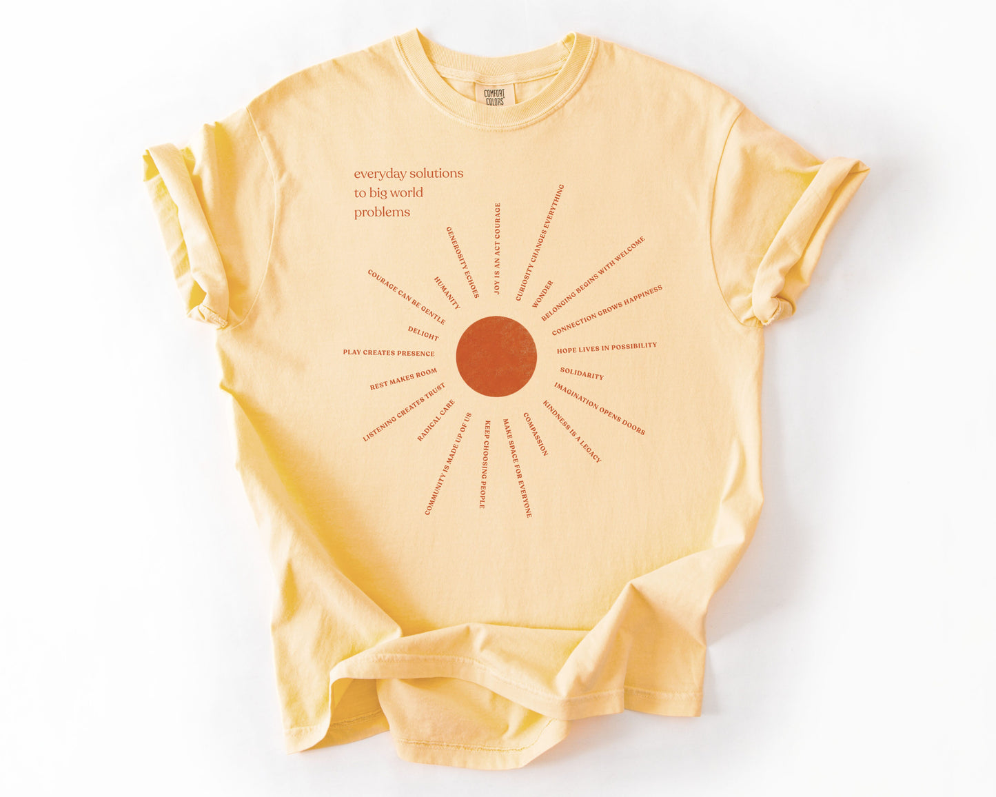 Everyday Solutions To Big World Problems | Community Graphic Tee