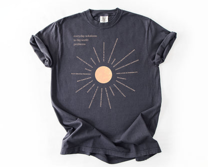 Everyday Solutions To Big World Problems | Community Graphic Tee